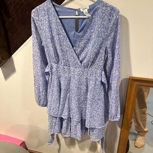 Blue long sleeve wrap blouse with v-neck and tiered ruffles